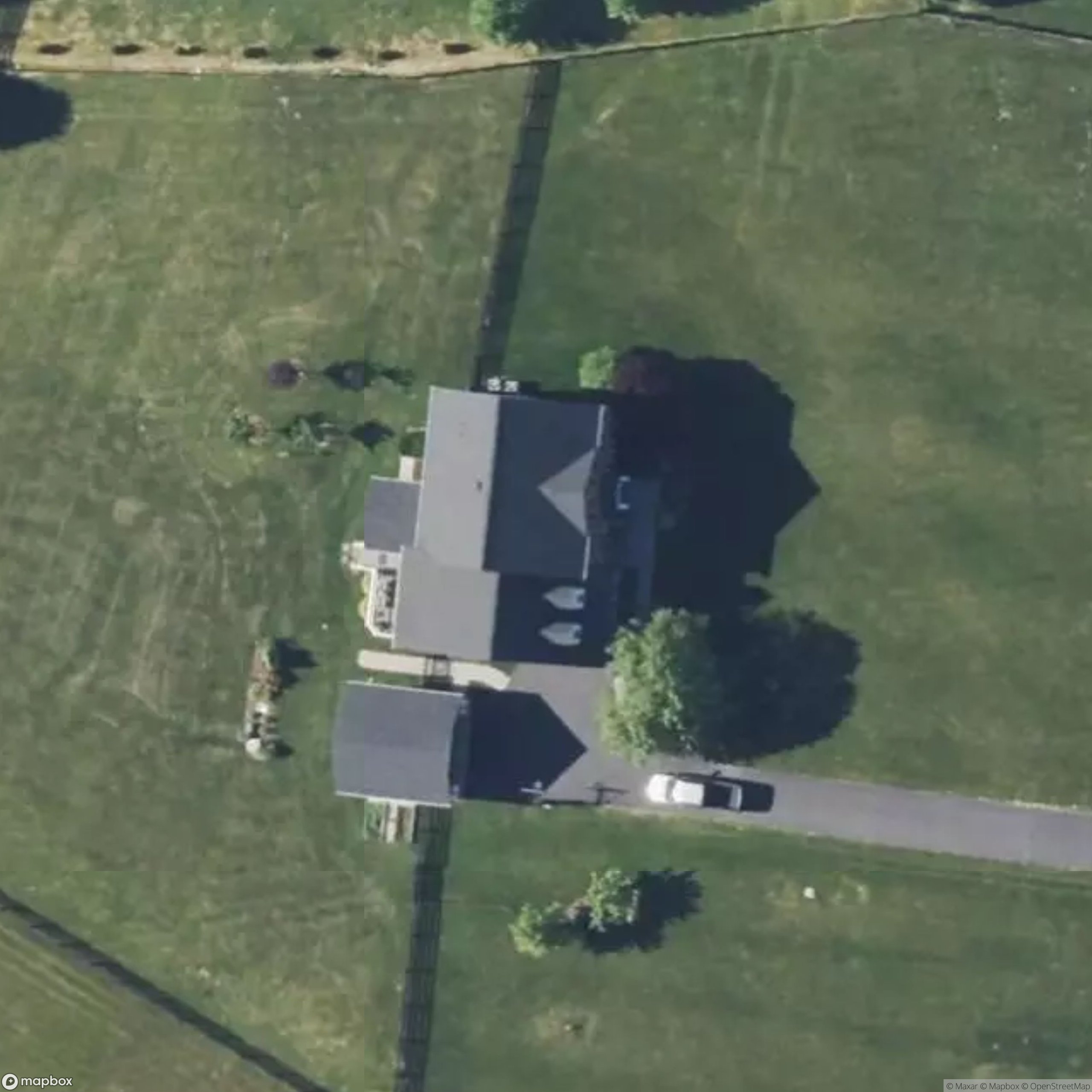Satellite aerial of the property before Frame
